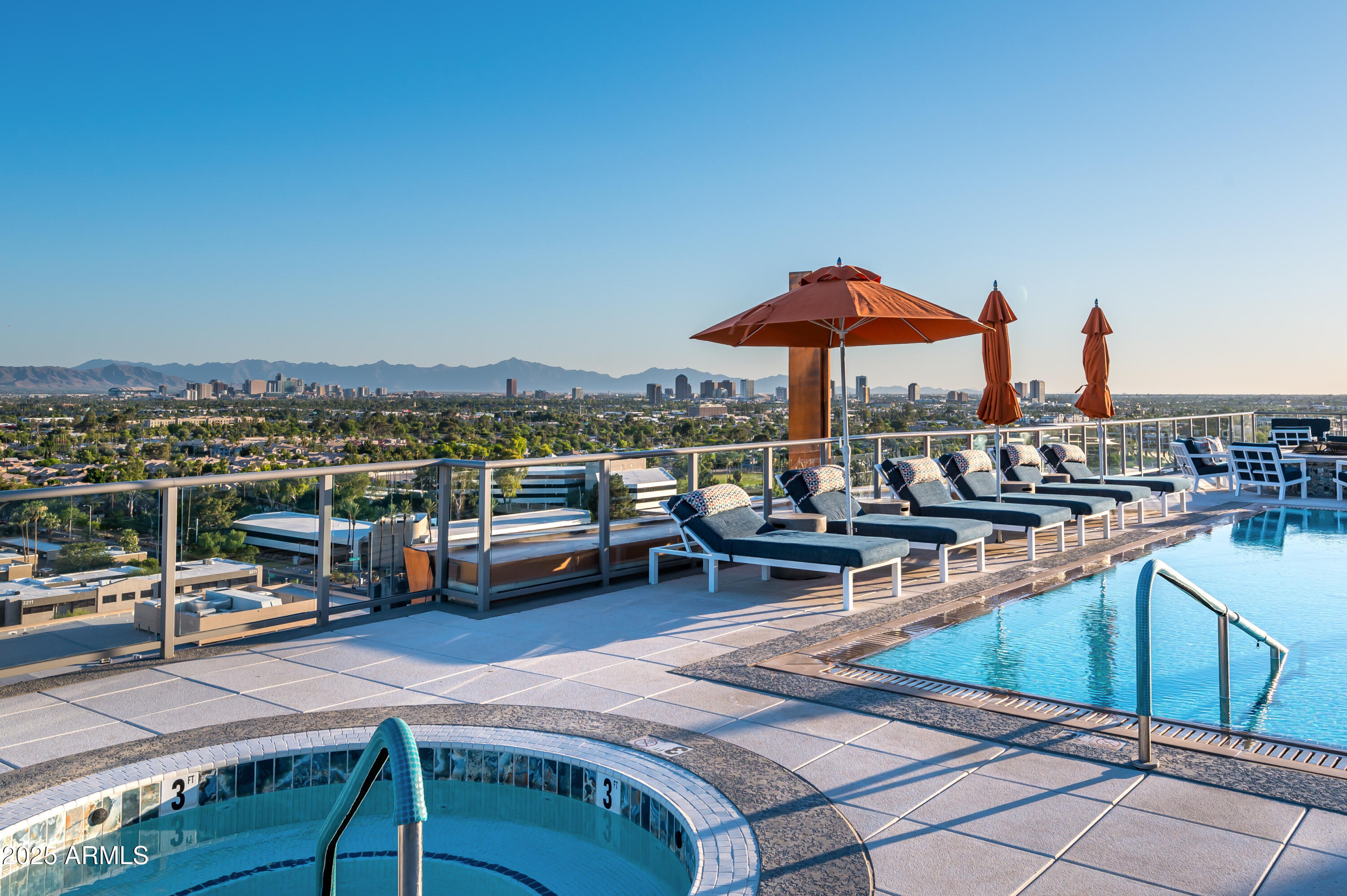 2211 East Camelback Road, Unit 601 Phoenix, AZ 85016 - Photo 40 of 61 a view of a terrace with chairs