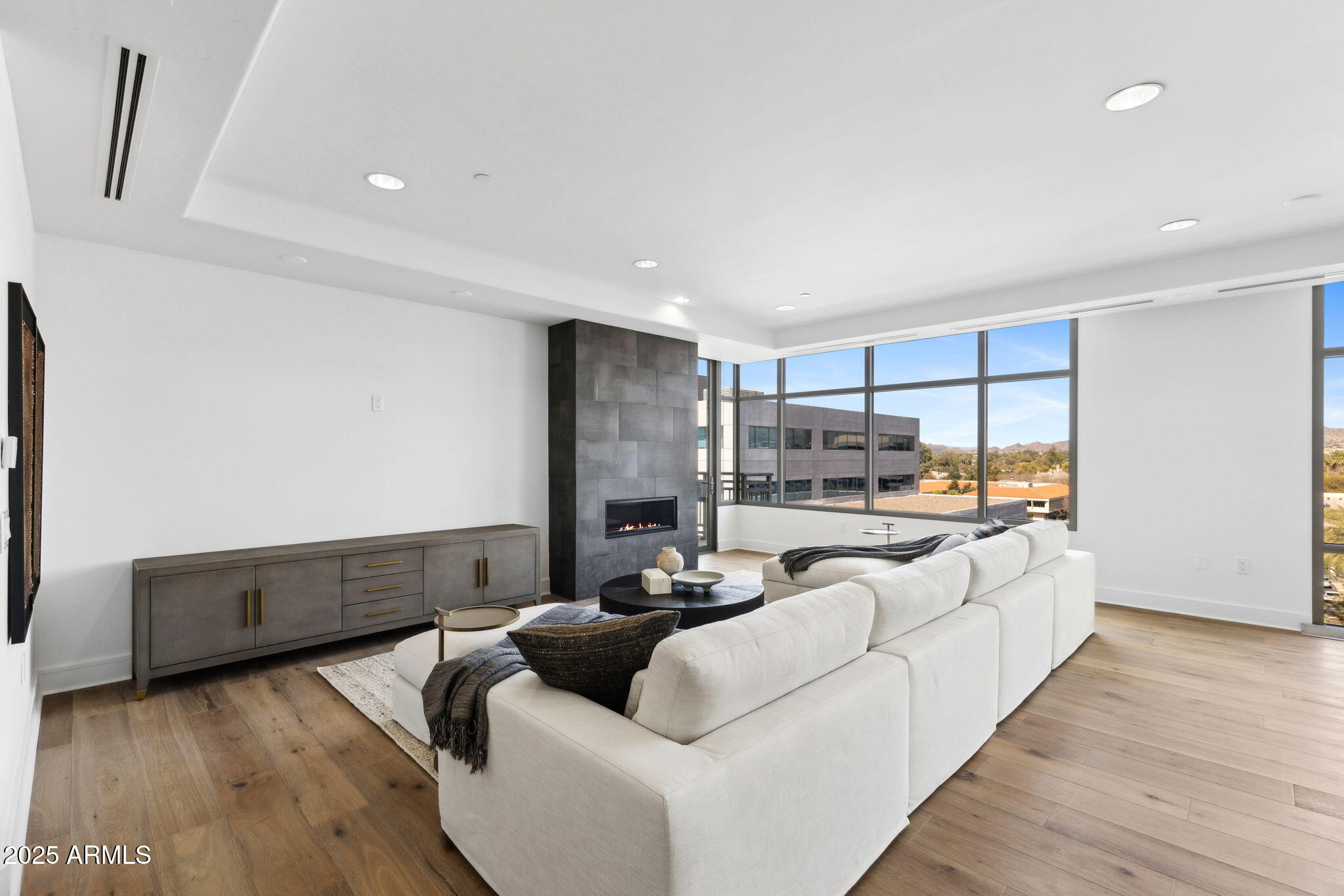 2211 East Camelback Road, Unit 601 Phoenix, AZ 85016 - Photo 4 of 61 a living room with furniture and a large window