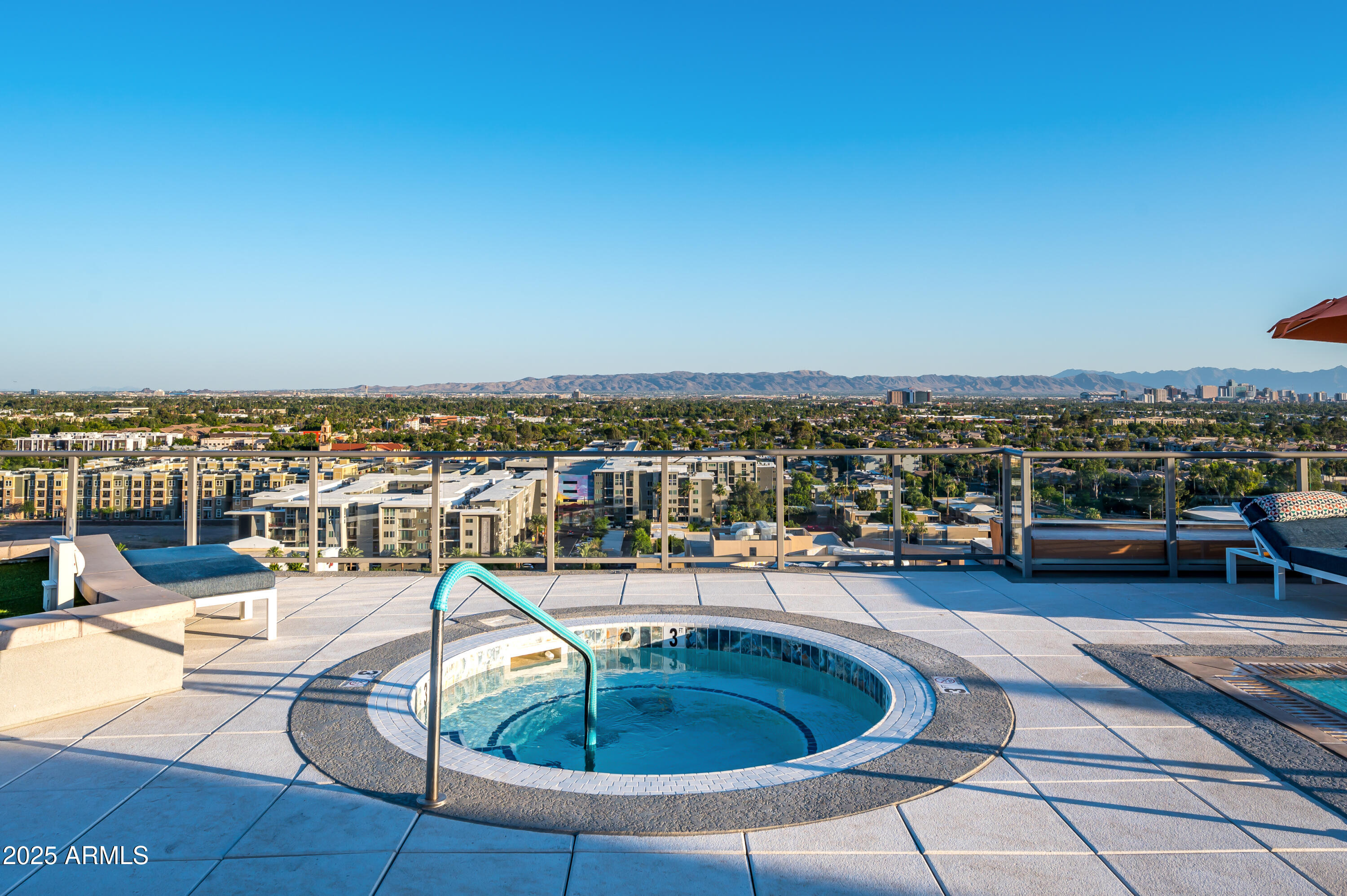 2211 East Camelback Road, Unit 601 Phoenix, AZ 85016 - Photo 41 of 61 a view of a swimming pool with lounge chair
