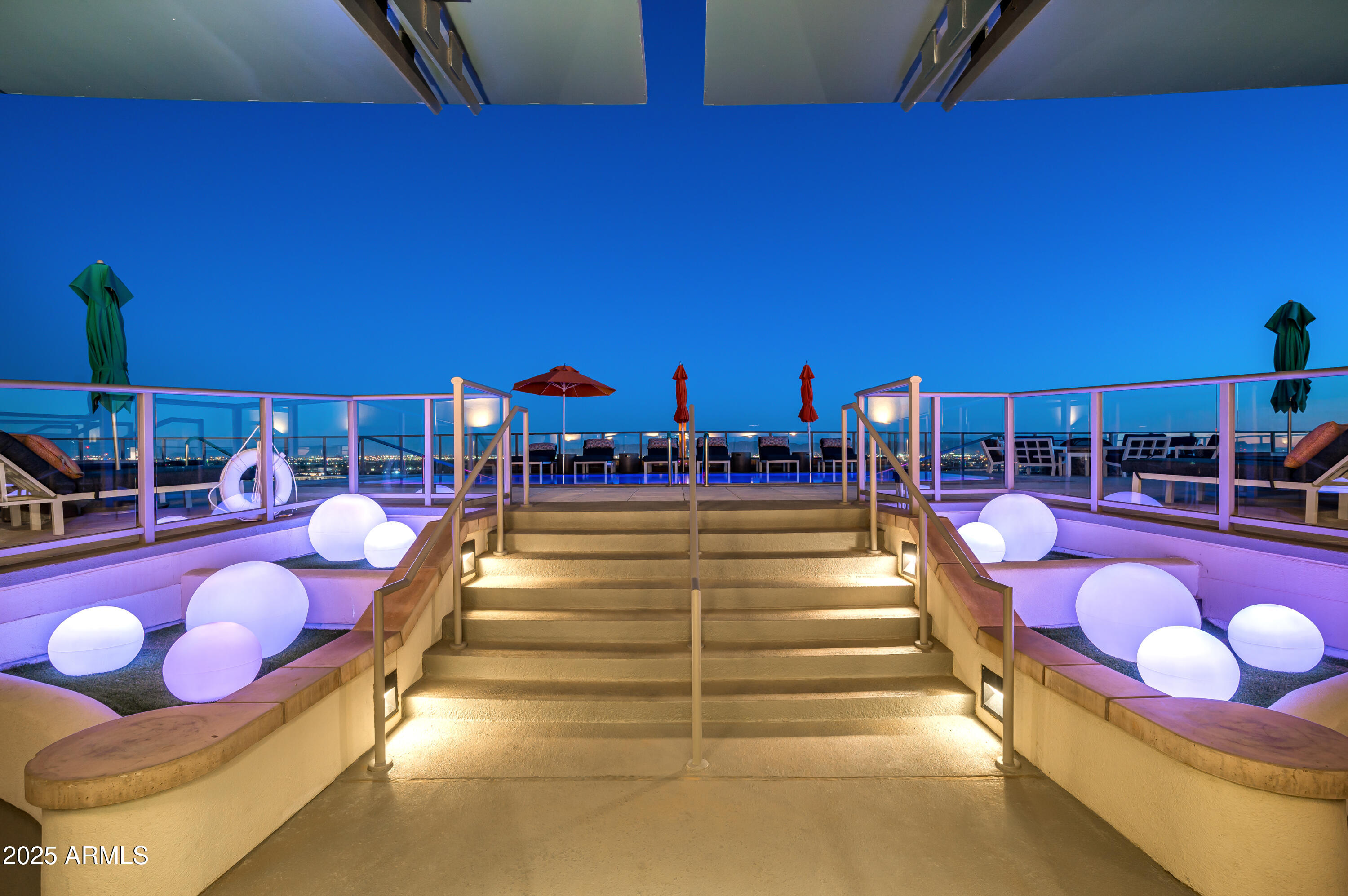2211 East Camelback Road, Unit 601 Phoenix, AZ 85016 - Photo 45 of 61 a swimming pool with outdoor seating