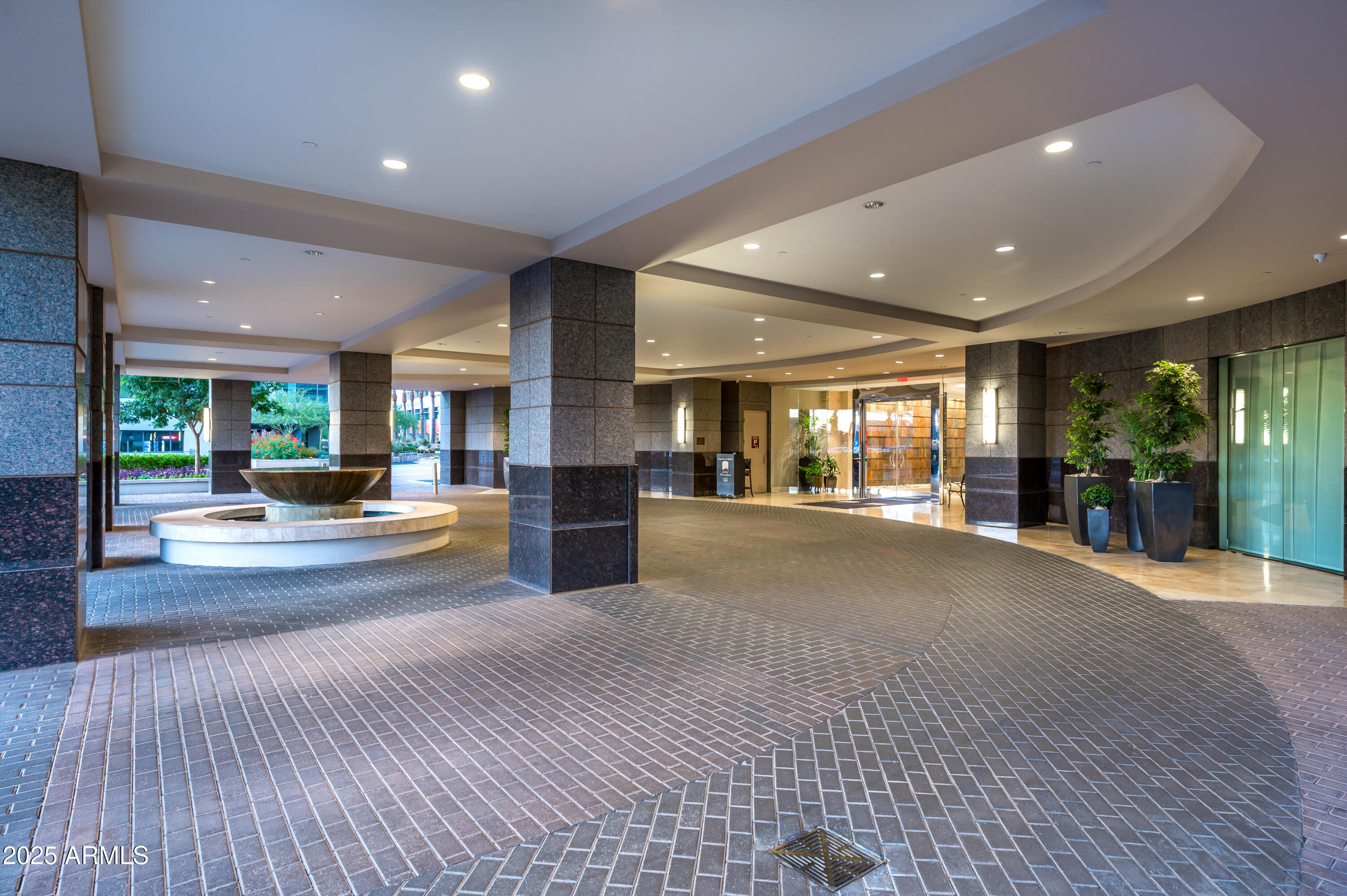2211 East Camelback Road, Unit 601 Phoenix, AZ 85016 - Photo 52 of 61 a view of living room with furniture and garden view
