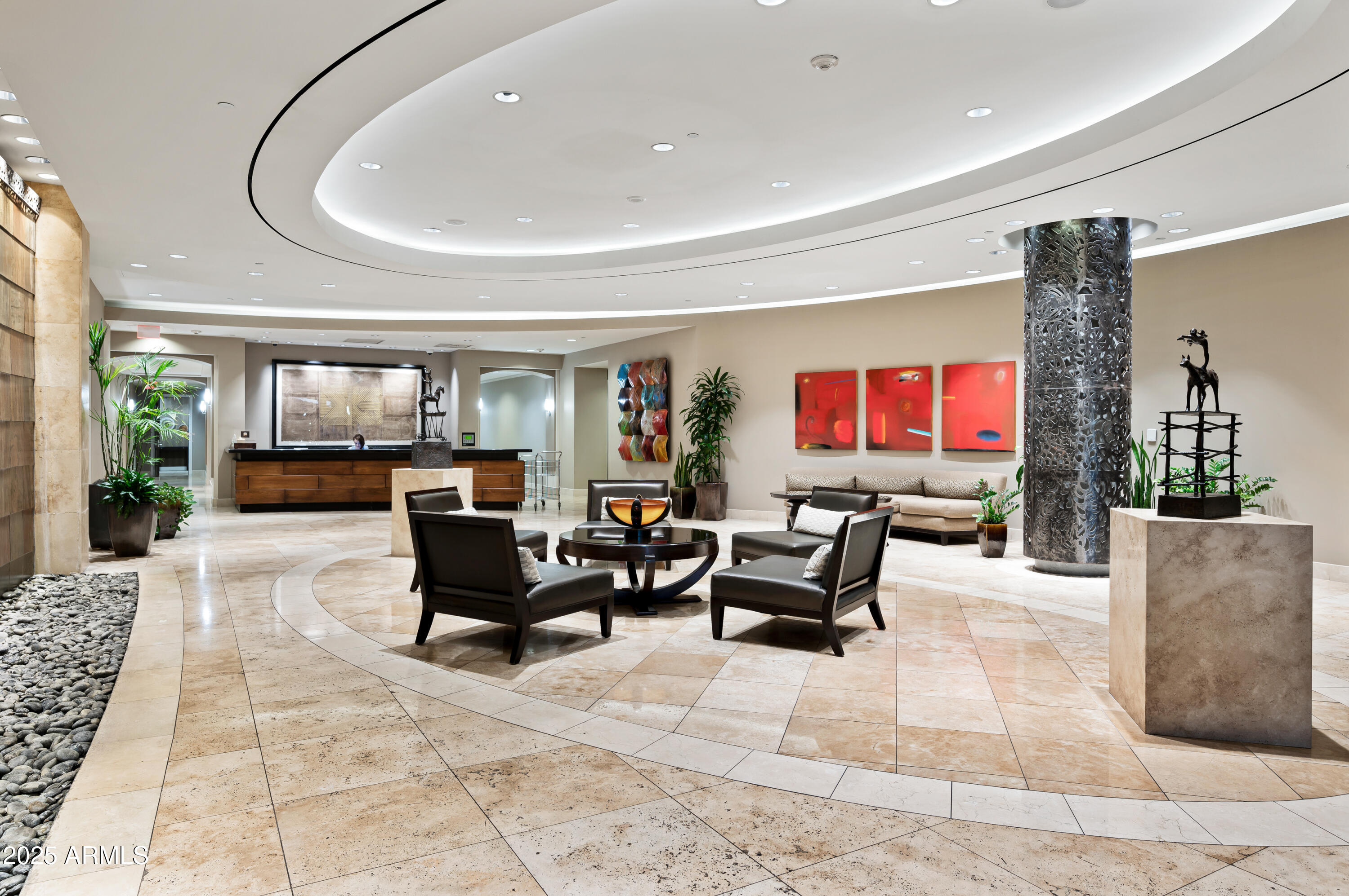 2211 East Camelback Road, Unit 601 Phoenix, AZ 85016 - Photo 53 of 61 a living room with furniture a rug and a flat screen tv