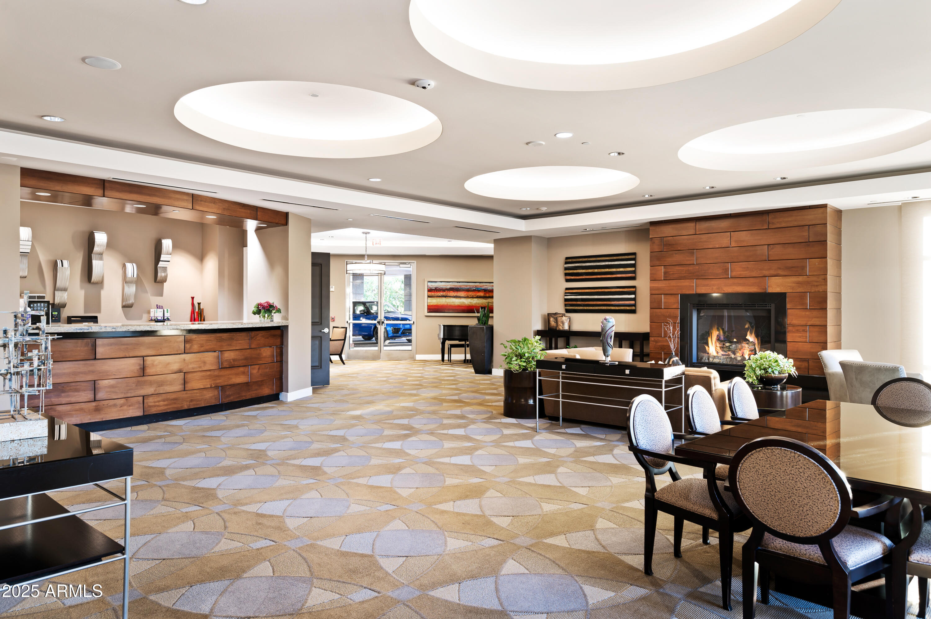 2211 East Camelback Road, Unit 601 Phoenix, AZ 85016 - Photo 57 of 61 a living room with furniture a flat screen tv and large windows