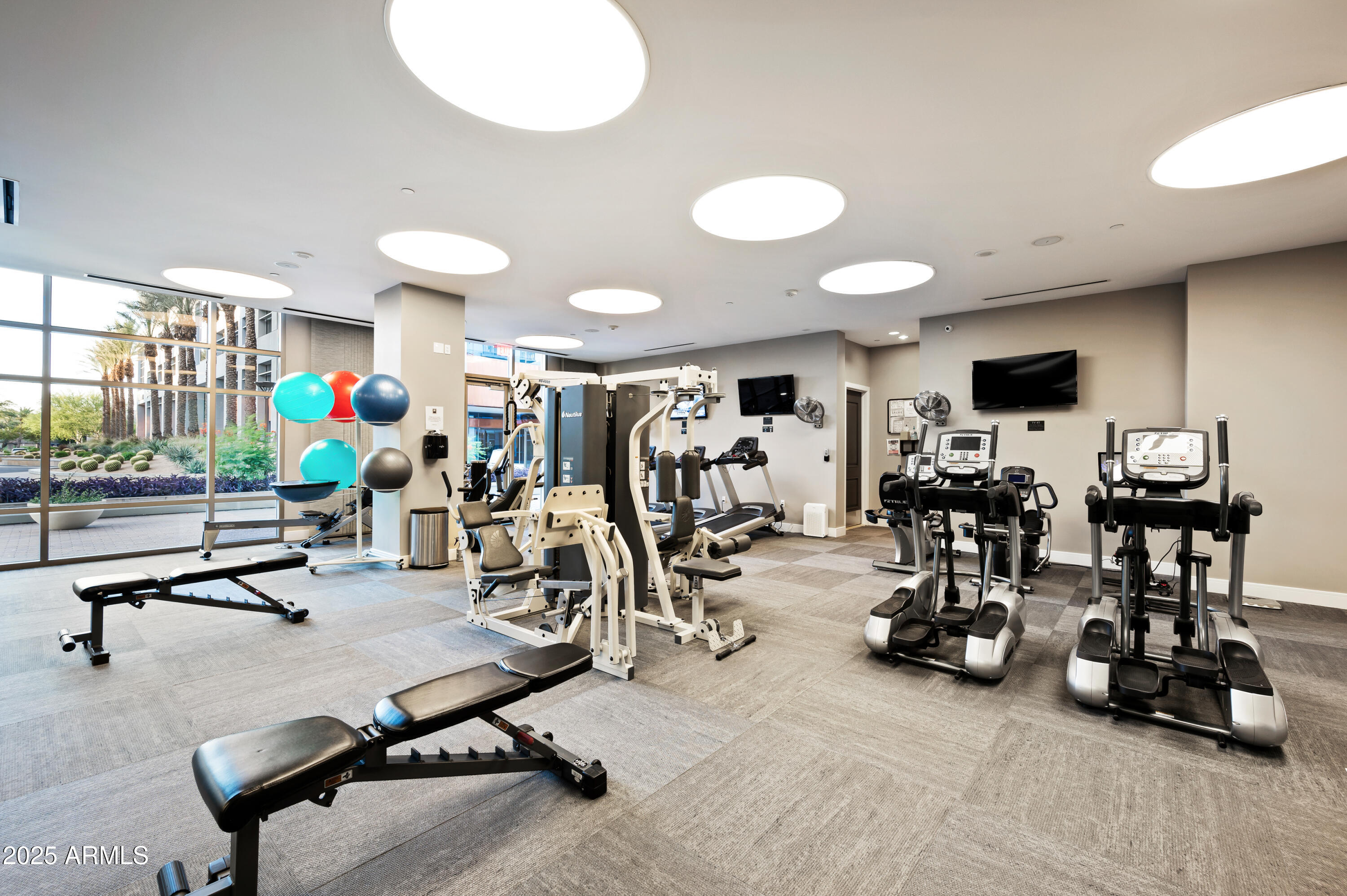 2211 East Camelback Road, Unit 601 Phoenix, AZ 85016 - Photo 60 of 61 a view of a room with gym equipment
