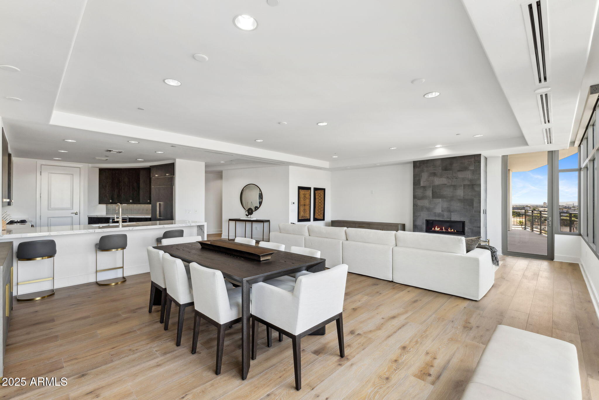 2211 East Camelback Road, Unit 601 Phoenix, AZ 85016 - Photo 8 of 61 a view of a dining room with furniture and a kitchen