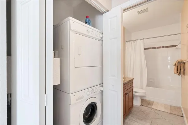 a view of bathroom with washer and dryer