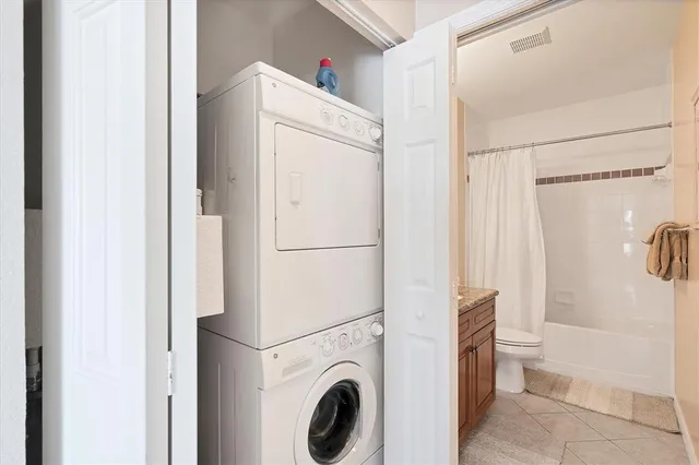 a view of bathroom with washer and dryer