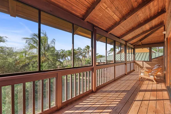 a view of a balcony with wooden floor