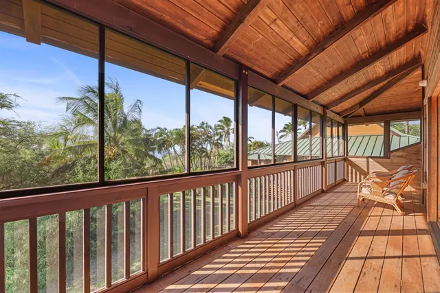 a view of a balcony with wooden floor
