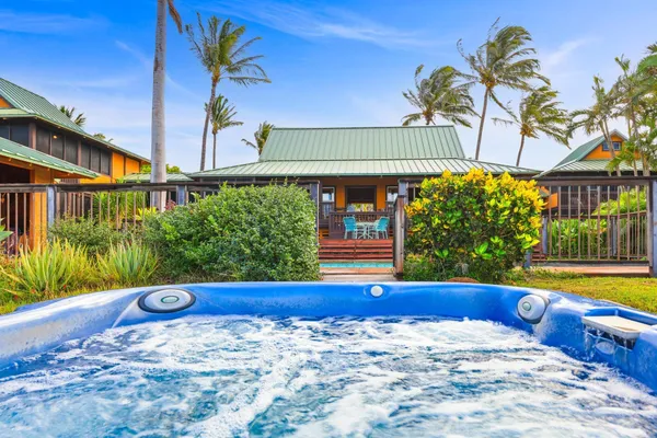 a yellow building with trees in front of it