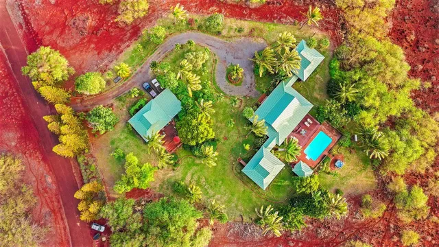 a living room with furniture a flat screen tv and next to a window