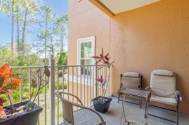 a view of a balcony with furniture