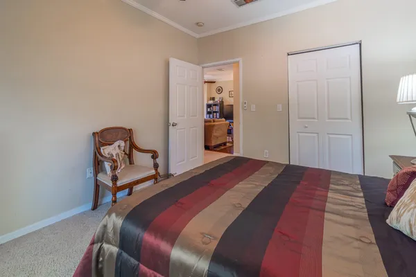 a bedroom with a bed and a table