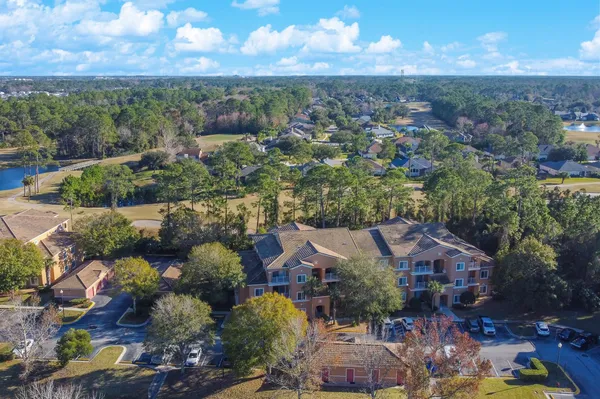 an aerial view of a house with a lake view