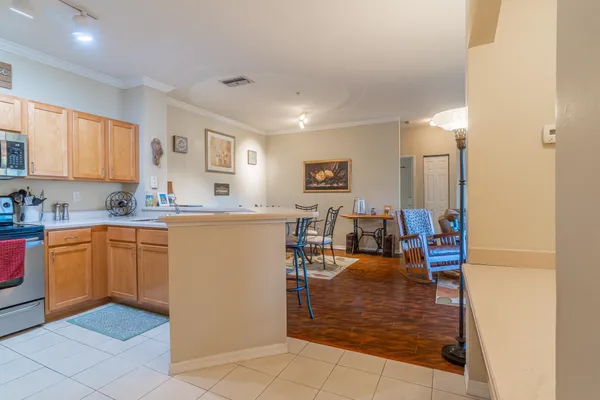 a kitchen view with granite countertop a sink and cabinets