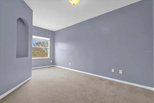 a view of an empty room with a window