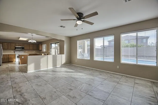 a view of a kitchen with a stove cabinets and a kitchen counter top space
