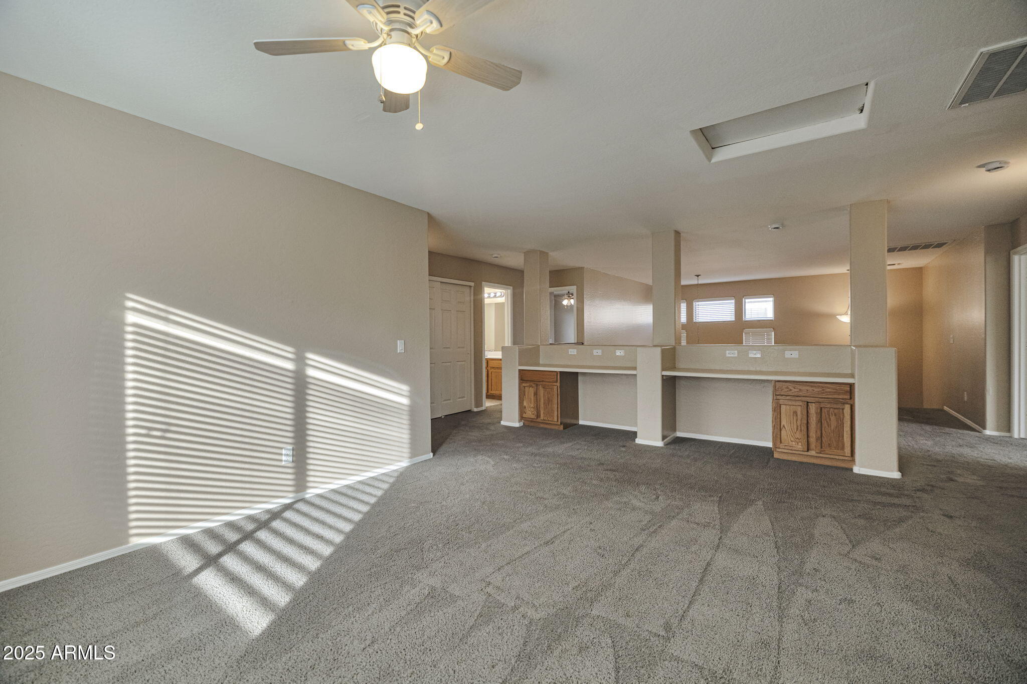 9705 West Riverside Avenue Tolleson, AZ 85353 - Photo 14 of 26 a view of a kitchen with a stove cabinets and a kitchen counter top space