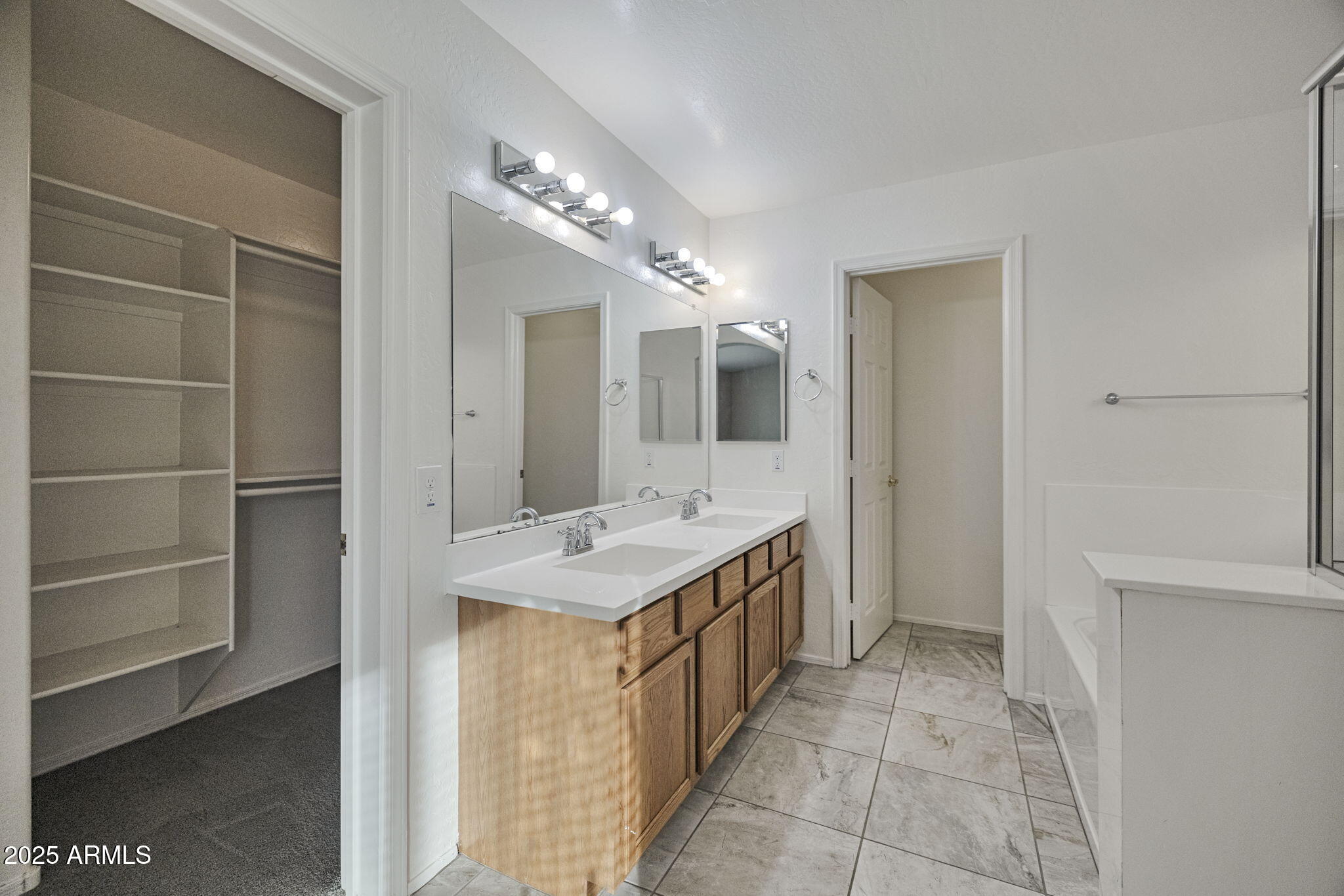 9705 West Riverside Avenue Tolleson, AZ 85353 - Photo 21 of 26 a bathroom with a sink and a mirror