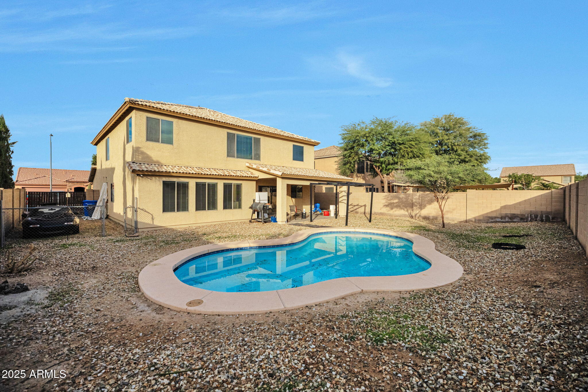 9705 West Riverside Avenue Tolleson, AZ 85353 - Photo 25 of 26 a house view with a swimming pool