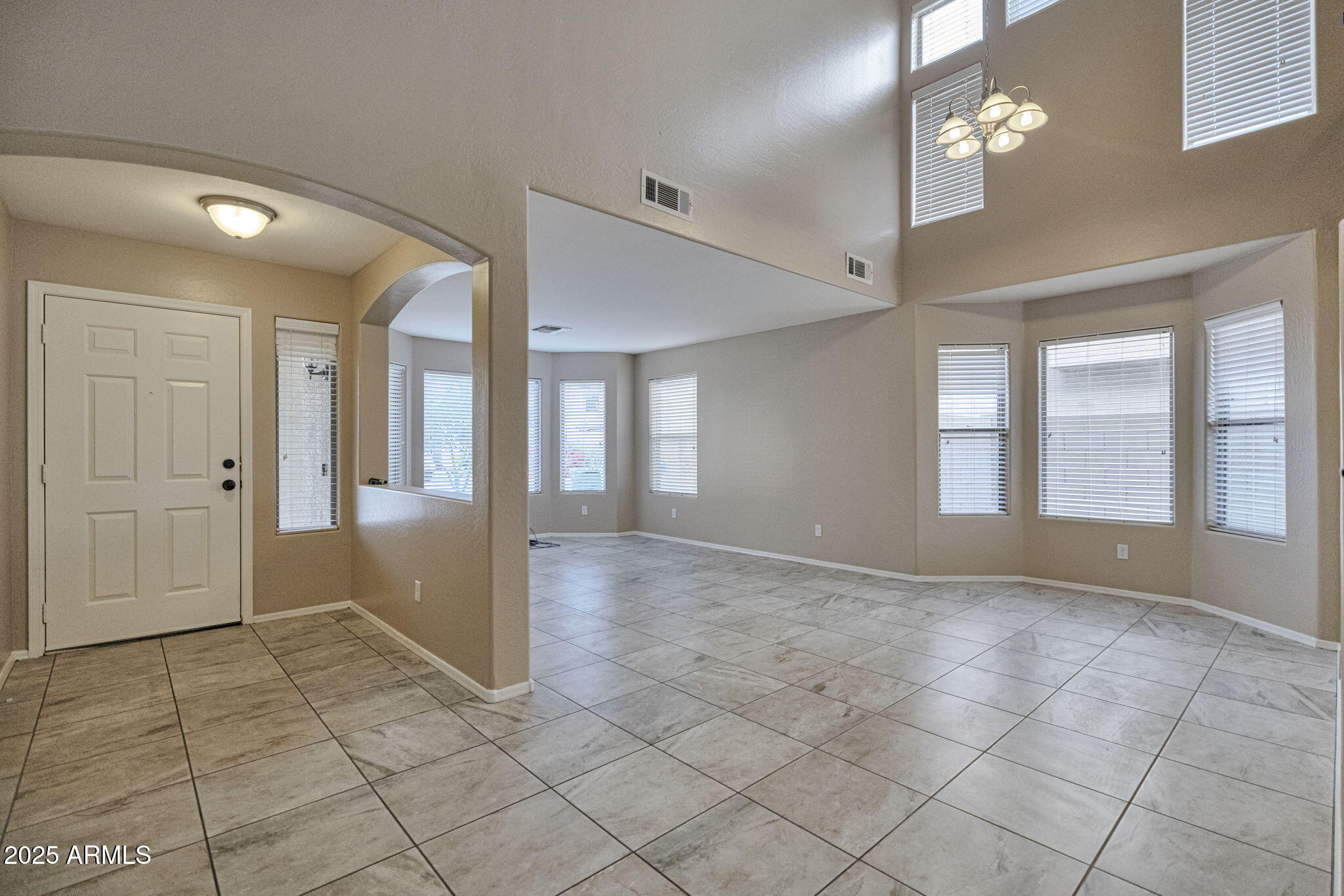9705 West Riverside Avenue Tolleson, AZ 85353 - Photo 5 of 26 a view of an empty room and window