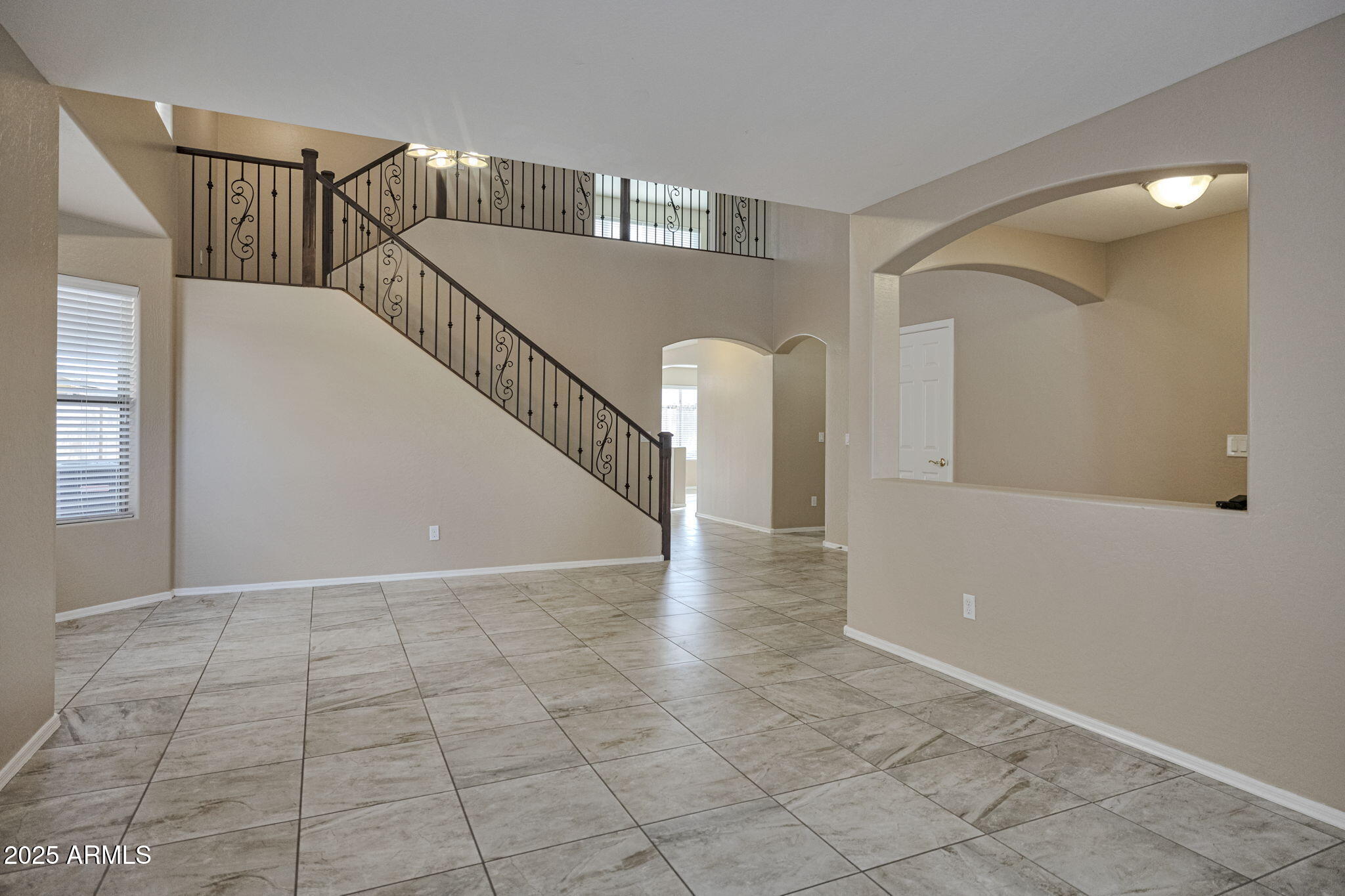 9705 West Riverside Avenue Tolleson, AZ 85353 - Photo 6 of 26 a view of entryway and hall with a window