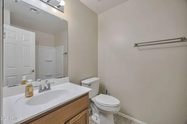 a view of an empty room with window and closet area