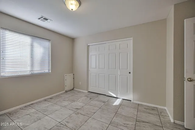 a kitchen with stainless steel appliances granite countertop a stove top oven sink and refrigerator