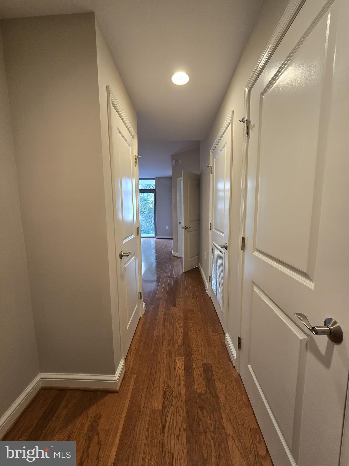 11990 Market Street, Unit 208 Reston, VA 20190 - Photo 4 of 16 a view of a room with wooden floor