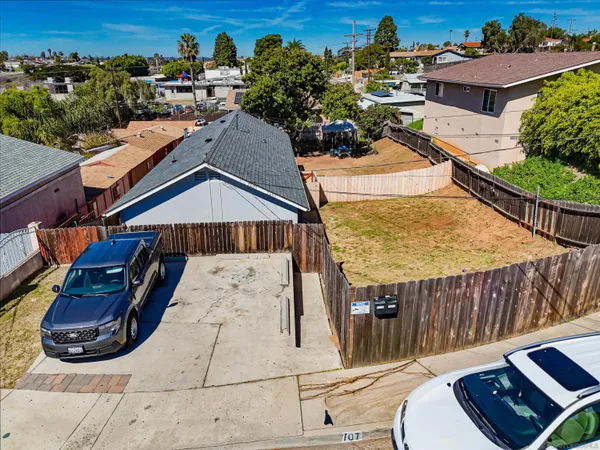 an aerial view of a house roof deck and patio