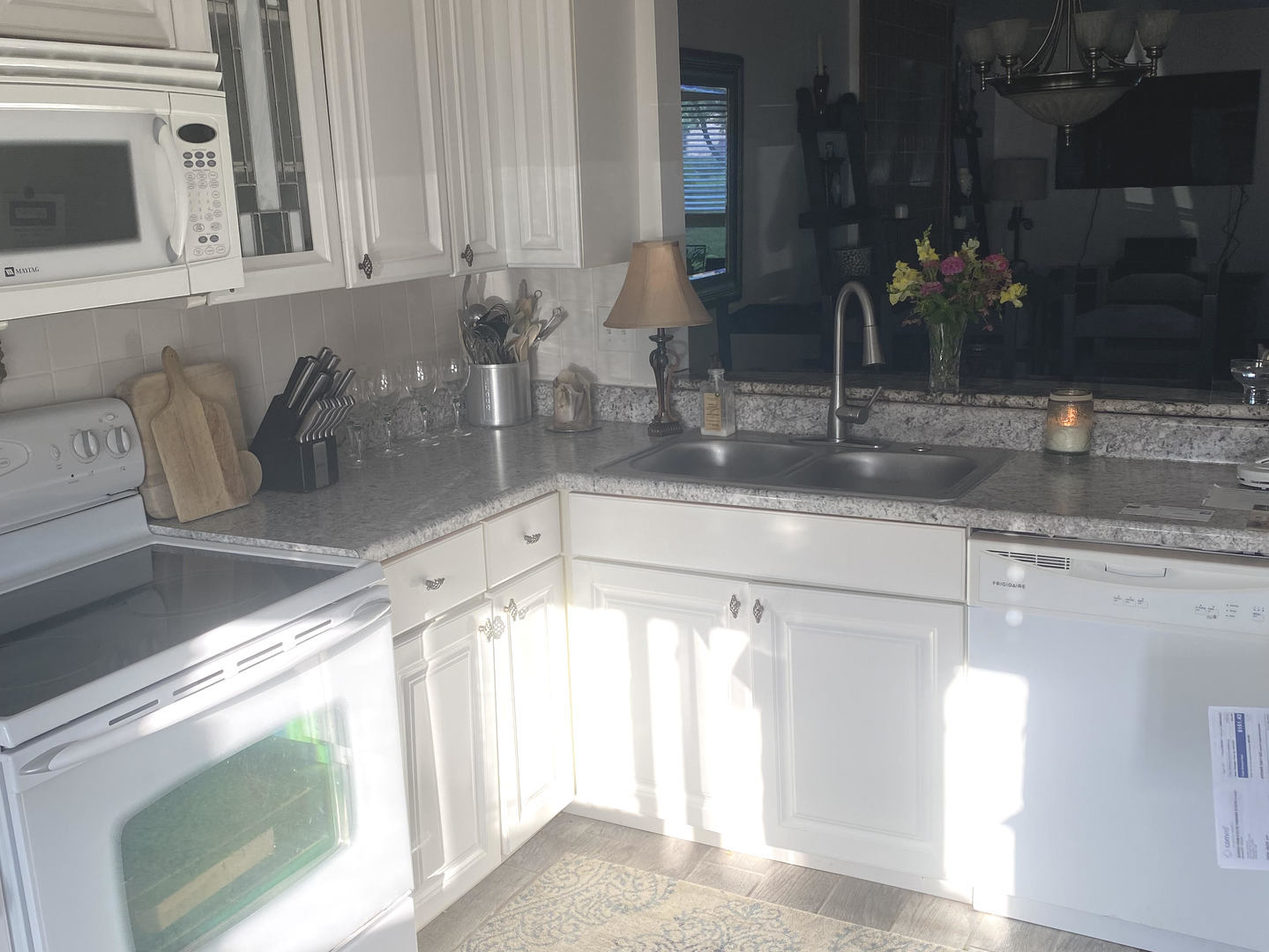 450 North Main Street, Unit S103 Wauconda, IL 60084 - Photo 9 of 14 a kitchen with a sink and a mirror