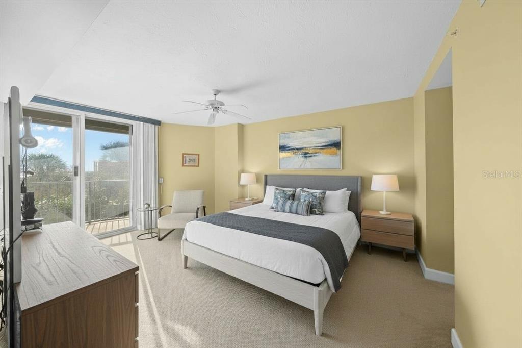 4575 South Atlantic Avenue, Unit 6209 Ponce Inlet, FL 32127 - Photo 13 of 31 a bedroom with a bed and a large window