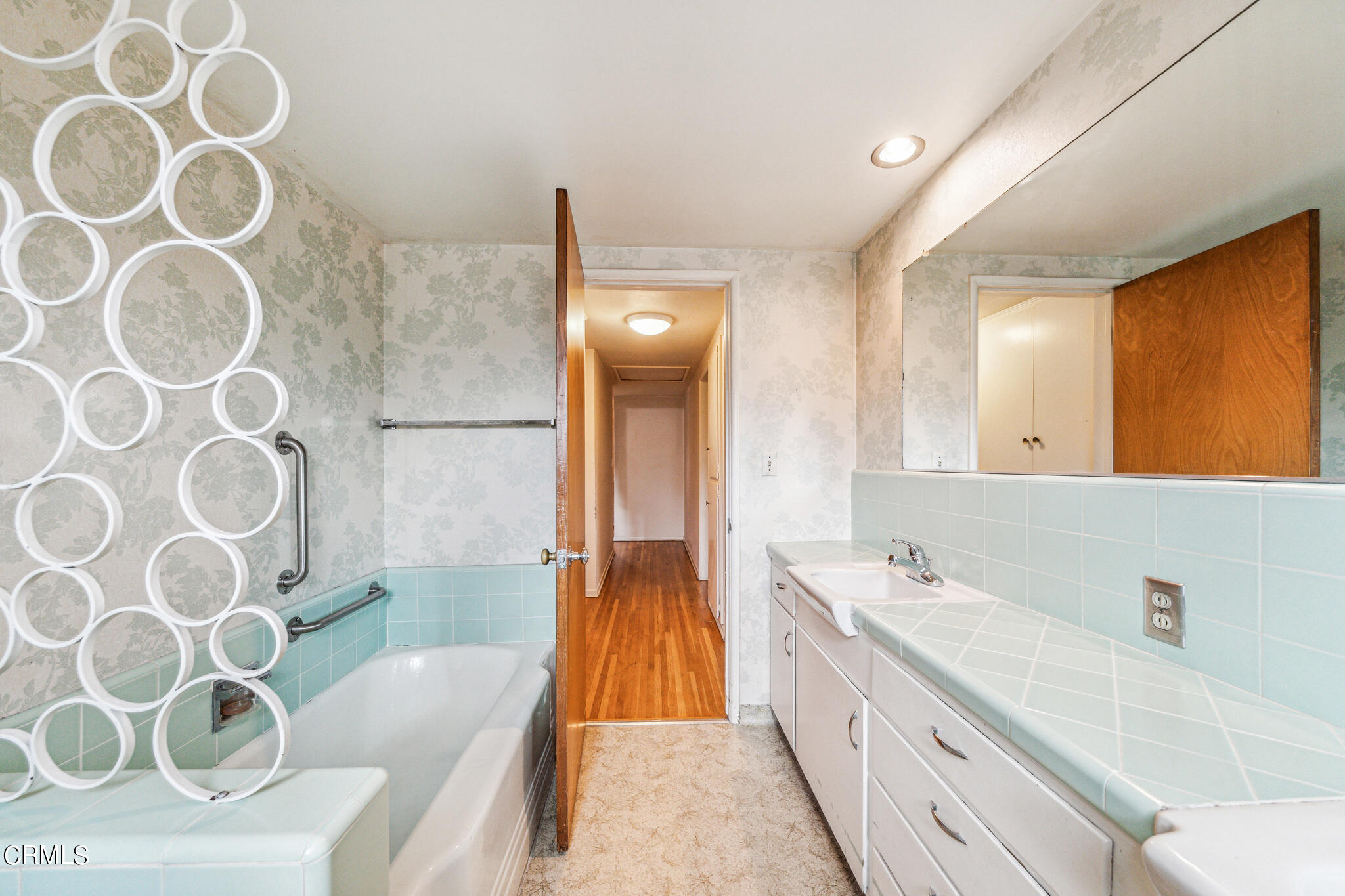 390 San Juan Place Pasadena, CA 91107 - Photo 20 of 29 a spacious bathroom with a double vanity sink and a mirror