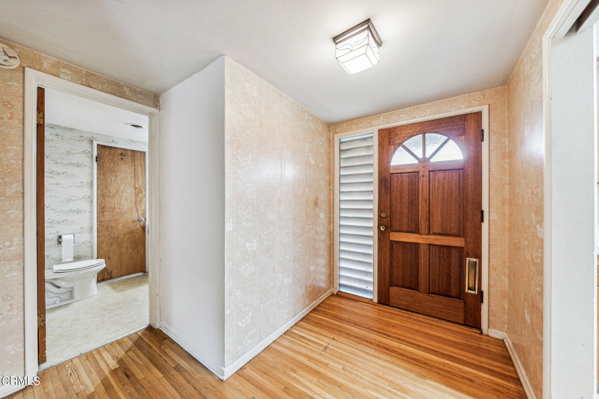 390 San Juan Place Pasadena, CA 91107 - Photo 2 of 29 a view of a hallway with wooden floor and a bathroom