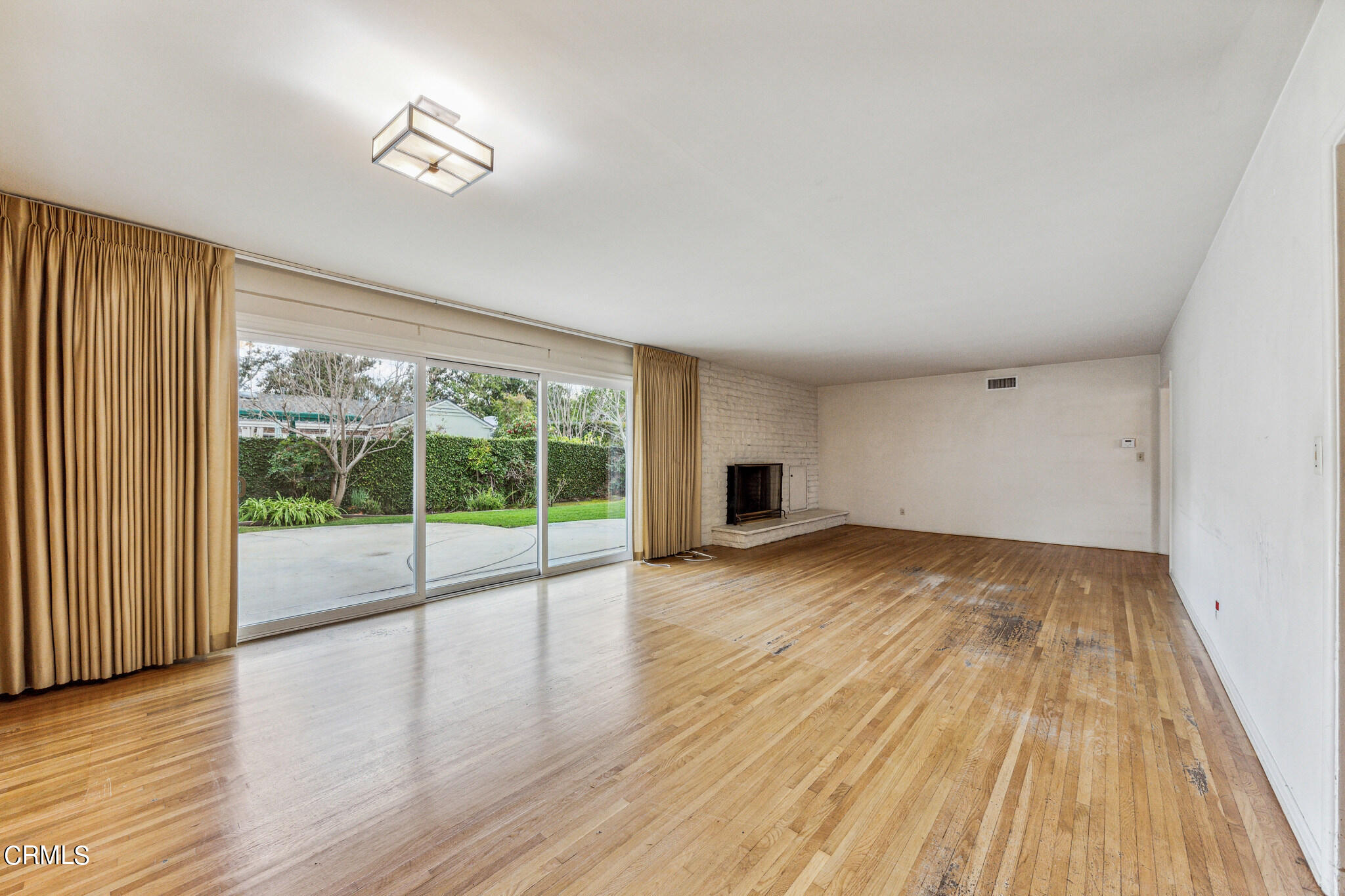 390 San Juan Place Pasadena, CA 91107 - Photo 5 of 29 a view of empty room with wooden floor and fan