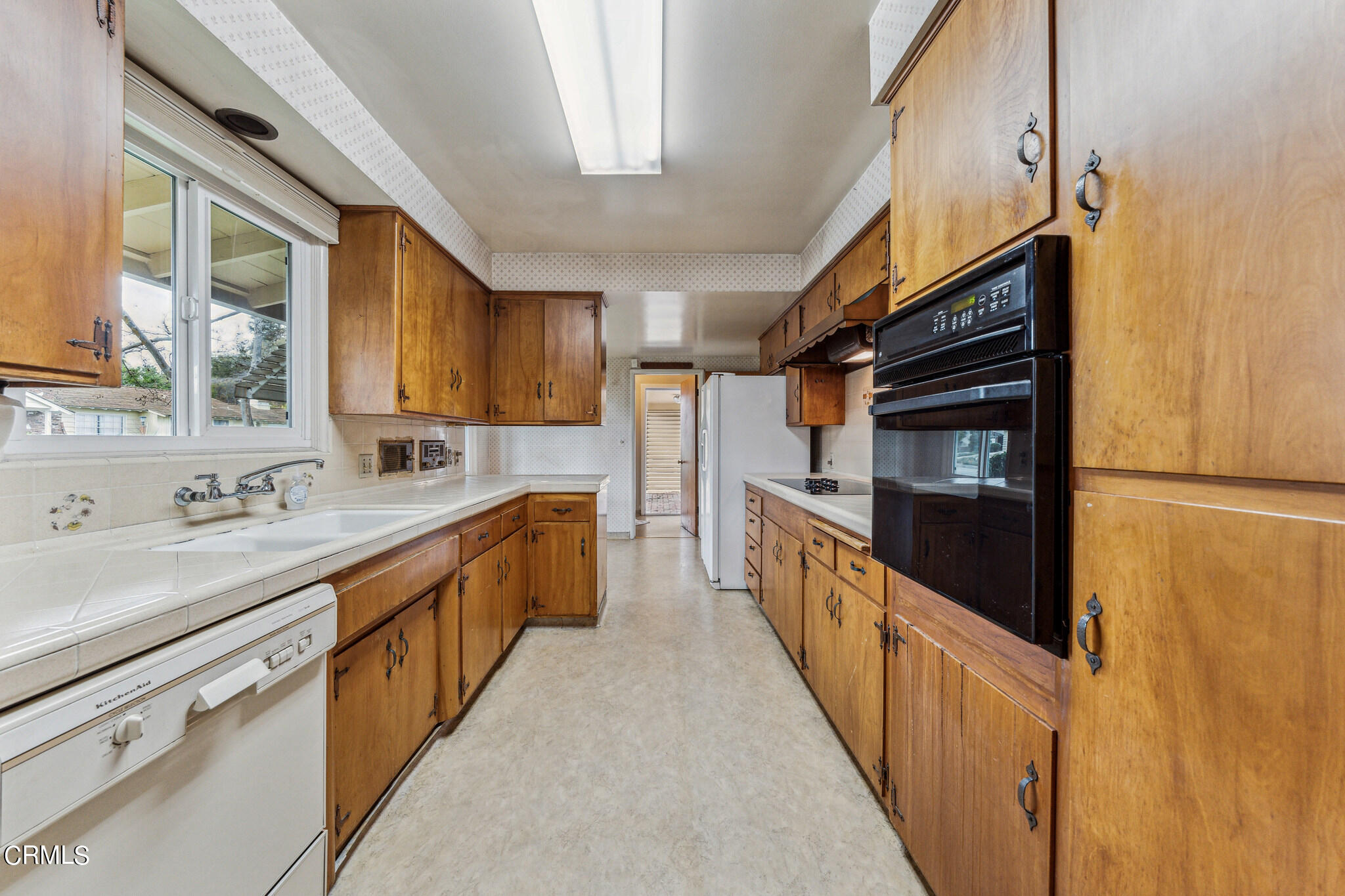390 San Juan Place Pasadena, CA 91107 - Photo 6 of 29 a large kitchen with stainless steel appliances sink a microwave and cabinets