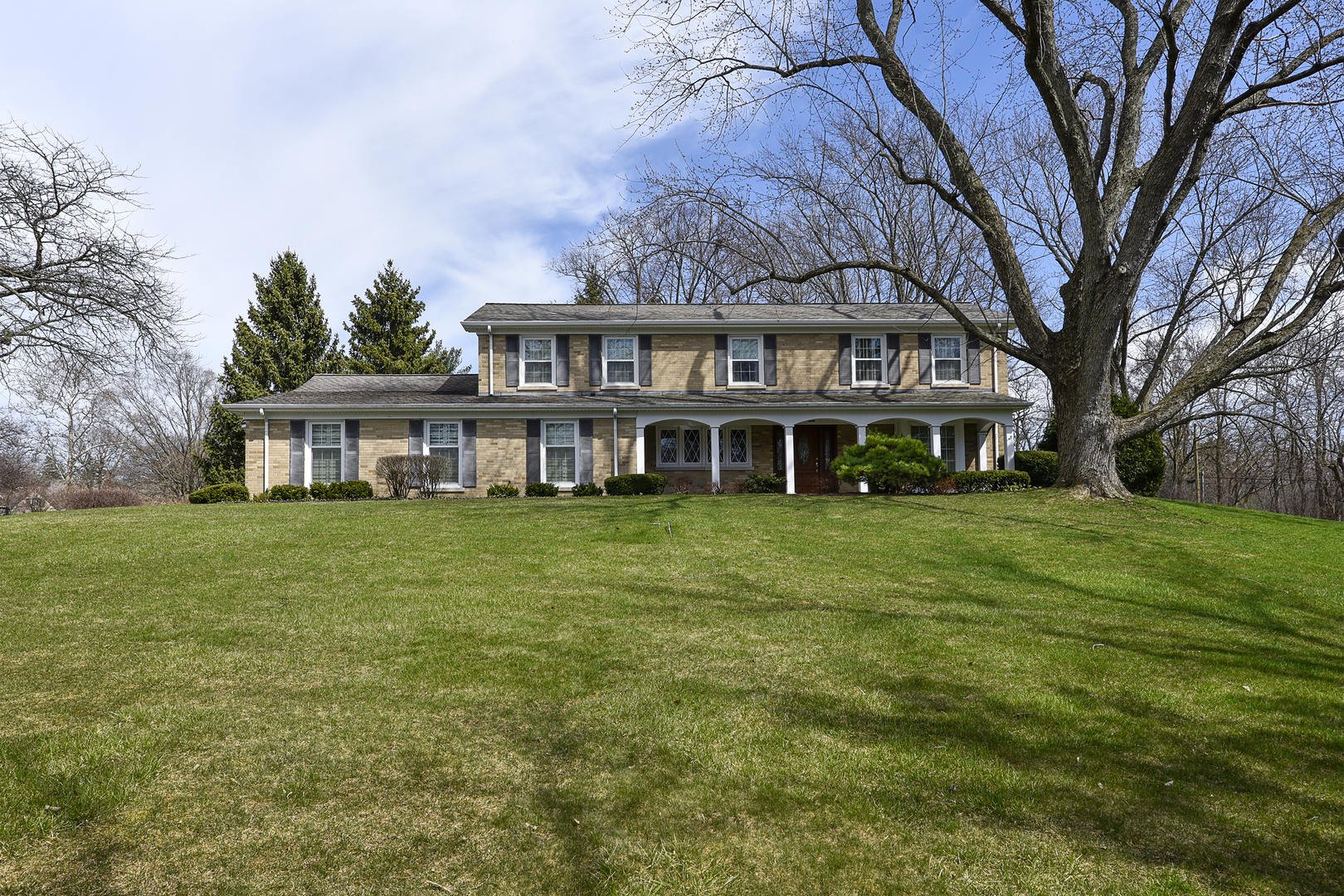 1495 Dunbar Road Inverness, IL 60067 - Photo 2 of 6 a front view of a house with a garden