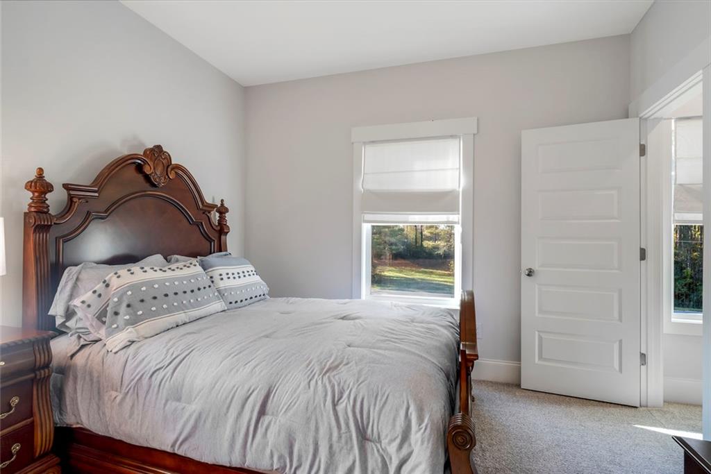 564 Old Airport Road Commerce, GA 30530 - Photo 19 of 39 a bedroom with a bed and a window