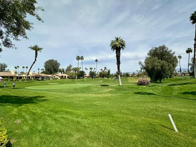 a view of a park with welcome board