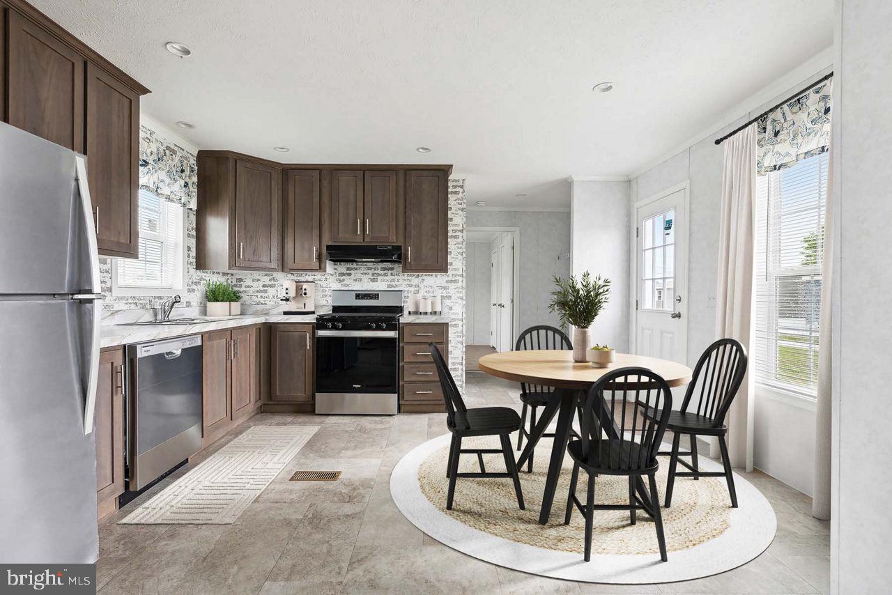35 Terrace Drive Spring City, PA 19475 - Photo 5 of 6 a kitchen with a table chairs refrigerator and cabinets
