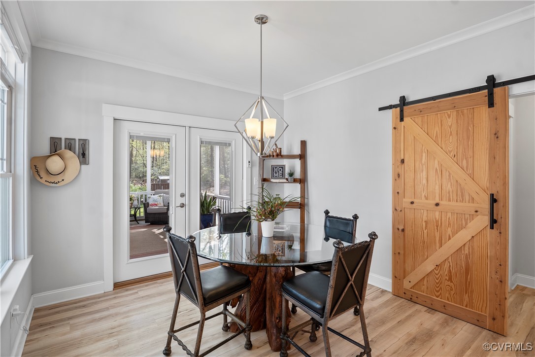 6213 Round Rock Road Chesterfield, VA 23838 - Photo 12 of 45 Breakfast area with notable chandelier, light wood