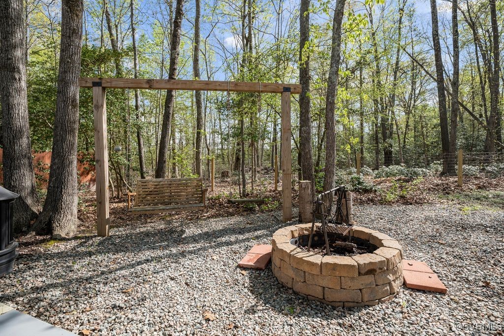 6213 Round Rock Road Chesterfield, VA 23838 - Photo 40 of 45 View of yard featuring an outdoor fire pit