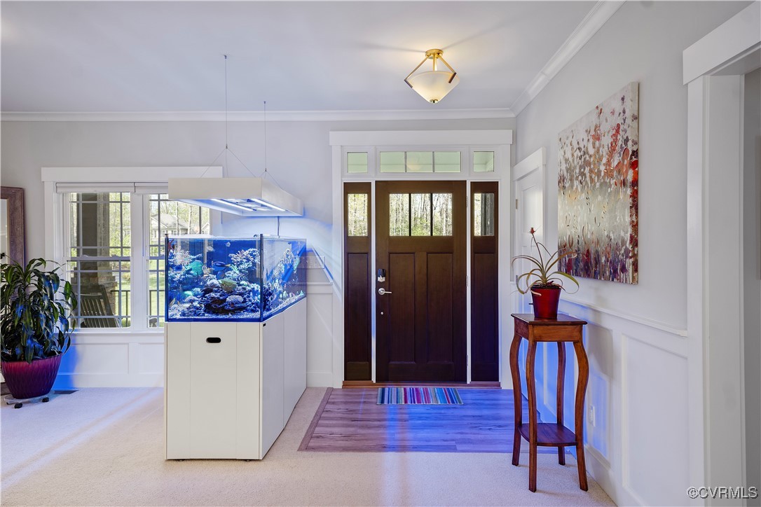 6213 Round Rock Road Chesterfield, VA 23838 - Photo 5 of 45 Carpeted foyer featuring crown molding, a decorati