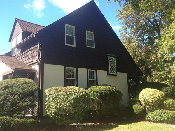 19 Brook Street, Unit 19 Wellesley, MA 02482 - Photo 1 of 13 a front view of a house with garden