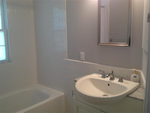 19 Brook Street, Unit 19 Wellesley, MA 02482 - Photo 12 of 13 a bathroom with a sink and a bathtub