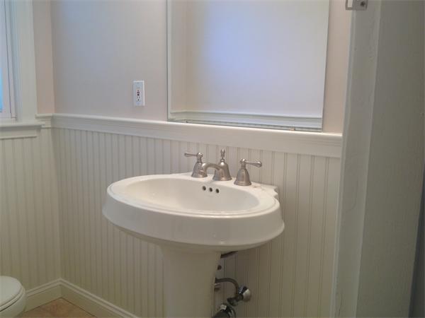 19 Brook Street, Unit 19 Wellesley, MA 02482 - Photo 13 of 13 a bathroom with a sink a toilet and mirror