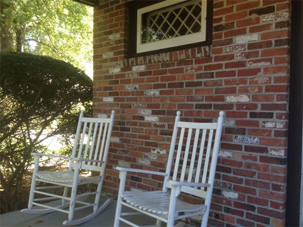 19 Brook Street, Unit 19 Wellesley, MA 02482 - Photo 3 of 13 a view of a door with a chair and table in the balcony