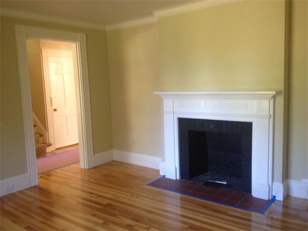 19 Brook Street, Unit 19 Wellesley, MA 02482 - Photo 4 of 13 a view of a livingroom with wooden floor and a fireplace