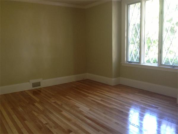 19 Brook Street, Unit 19 Wellesley, MA 02482 - Photo 9 of 13 an empty room with wooden floor and windows