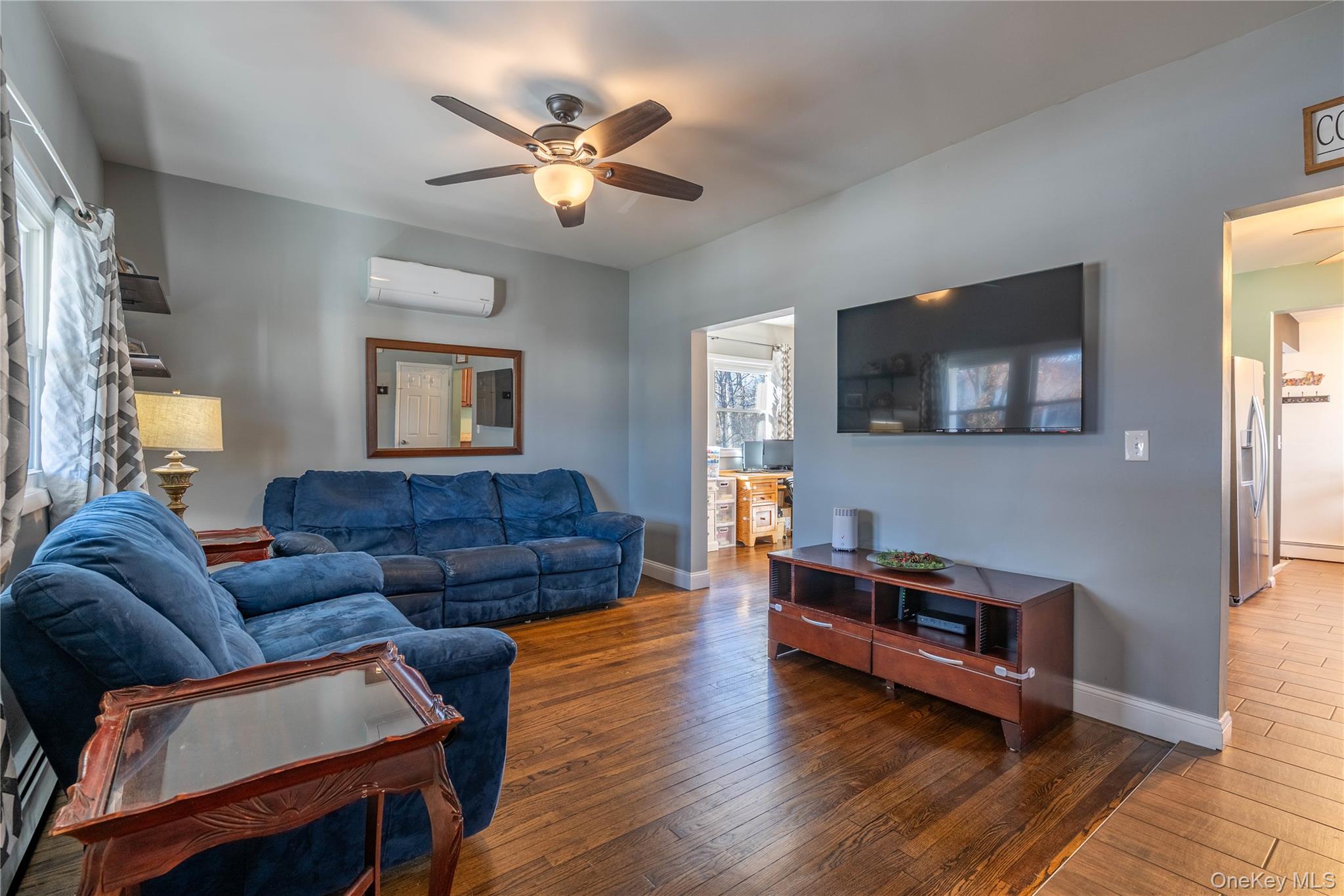28 Maple Street Cornwall, NY 12518 - Photo 2 of 32 Living area with ceiling fan, hardwood / wood-style flooring, and a wall unit AC